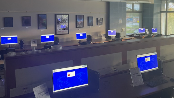 Rows of computers with blue screens