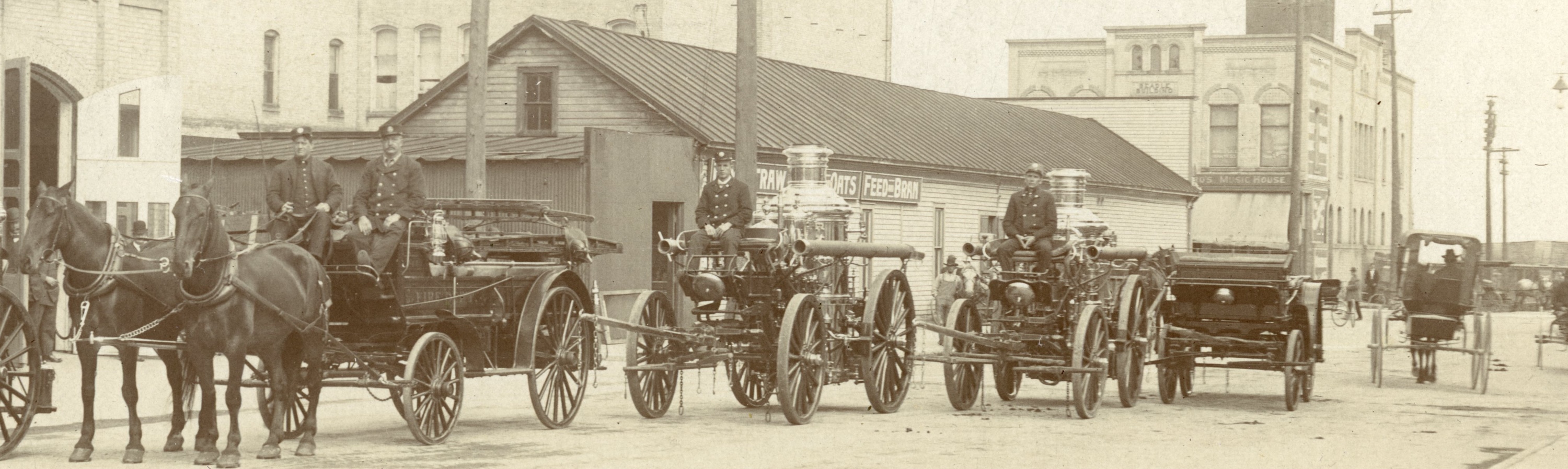 Photograph of Fire Department with steam engines