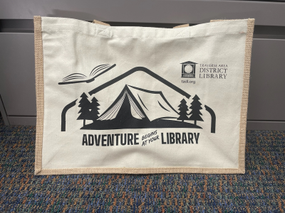 Beige canvas tote bag with Summer Reading 2024 logo
