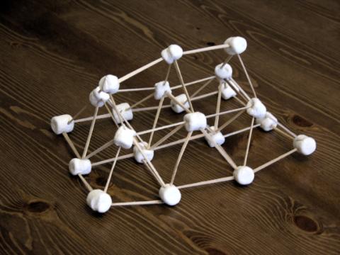 A small structure built with toothpicks and mini-marshmallows.