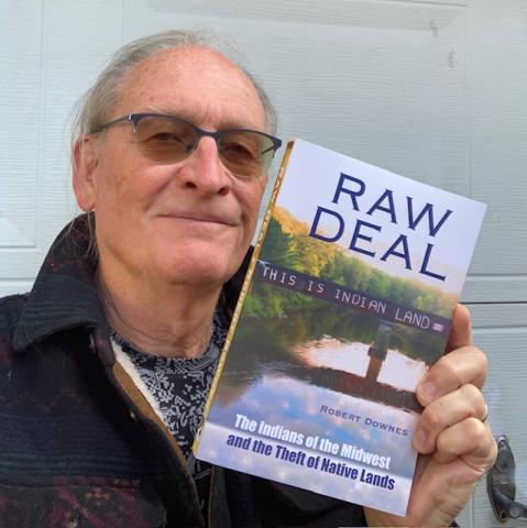 Picture of author with his book
