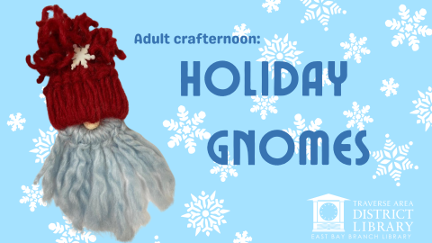 Gnome craft made out of yarn over a blue background with snowflakes