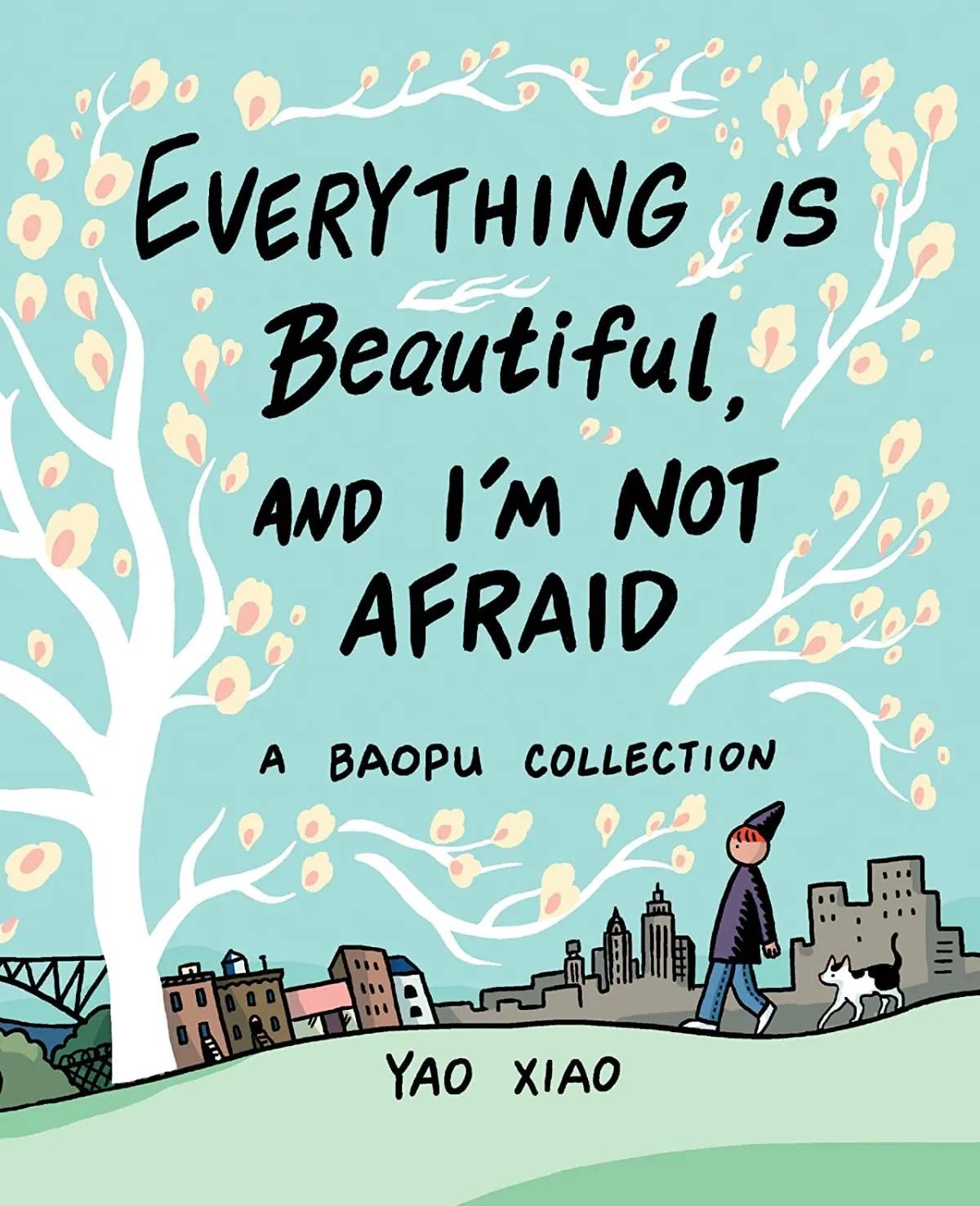 book cover for the book Everything is Beautiful and I’m Not Afraid: a Baopu Collection by Yao Xiao. In front of a blue sky, we see the black text of the title and author among a white tree with pink-orange leaves. A person wearing a dark grey pointy hat, dark grey long sleeved shirt, and blue jeans walks next to a black and white cat. In the background is a harsh grey city scape next to colorful buildings.