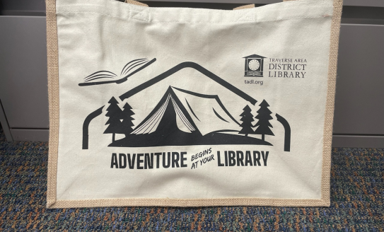 Beige canvas tote bag with Summer Reading 2024 logo